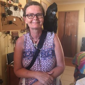 Donni Hakanson with black cockatoo Max on her shoulders.